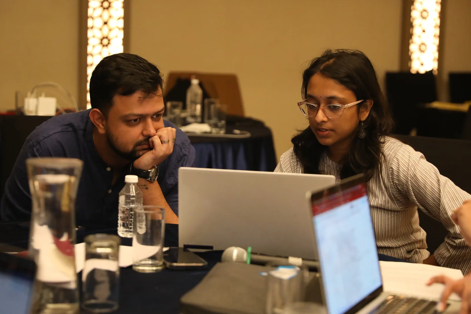 Two nonprofit data practitioners working through their data systems together at a Dalgo consulting workshop